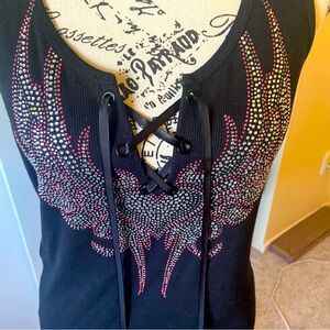 A rhinestone and tie front tank top. It’s very cute brand new with tags.
